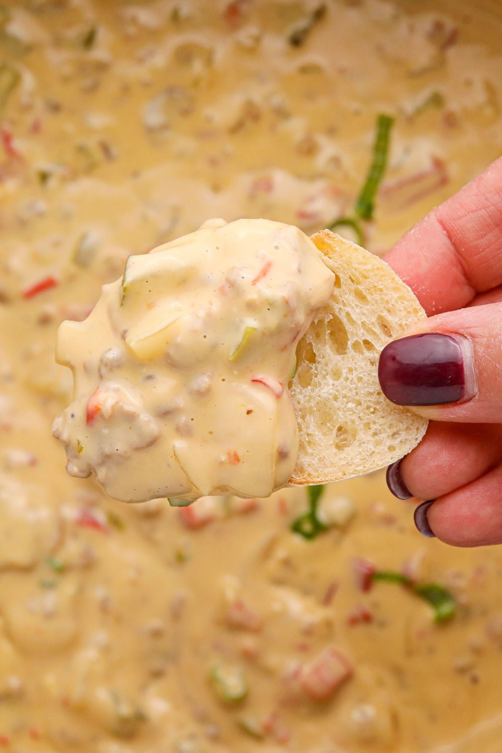 Crock Pot Philly Cheesesteak Dip on a piece of sliced bread