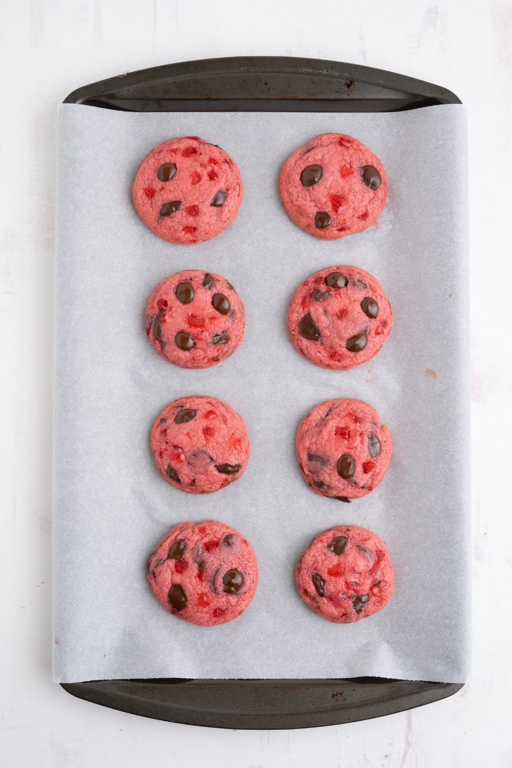 baked Cherry Chocolate Chip Cookies on a cookie sheet