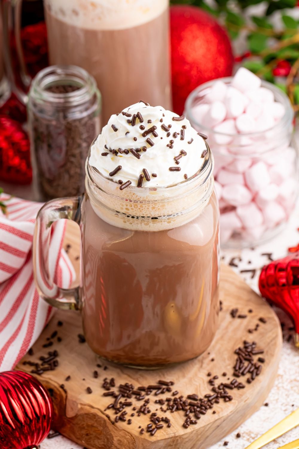Dirty Snowman (Adult Hot Chocolate) in a glass mason jar with a handle. Then you have mints in a jar and sprinkles around the table