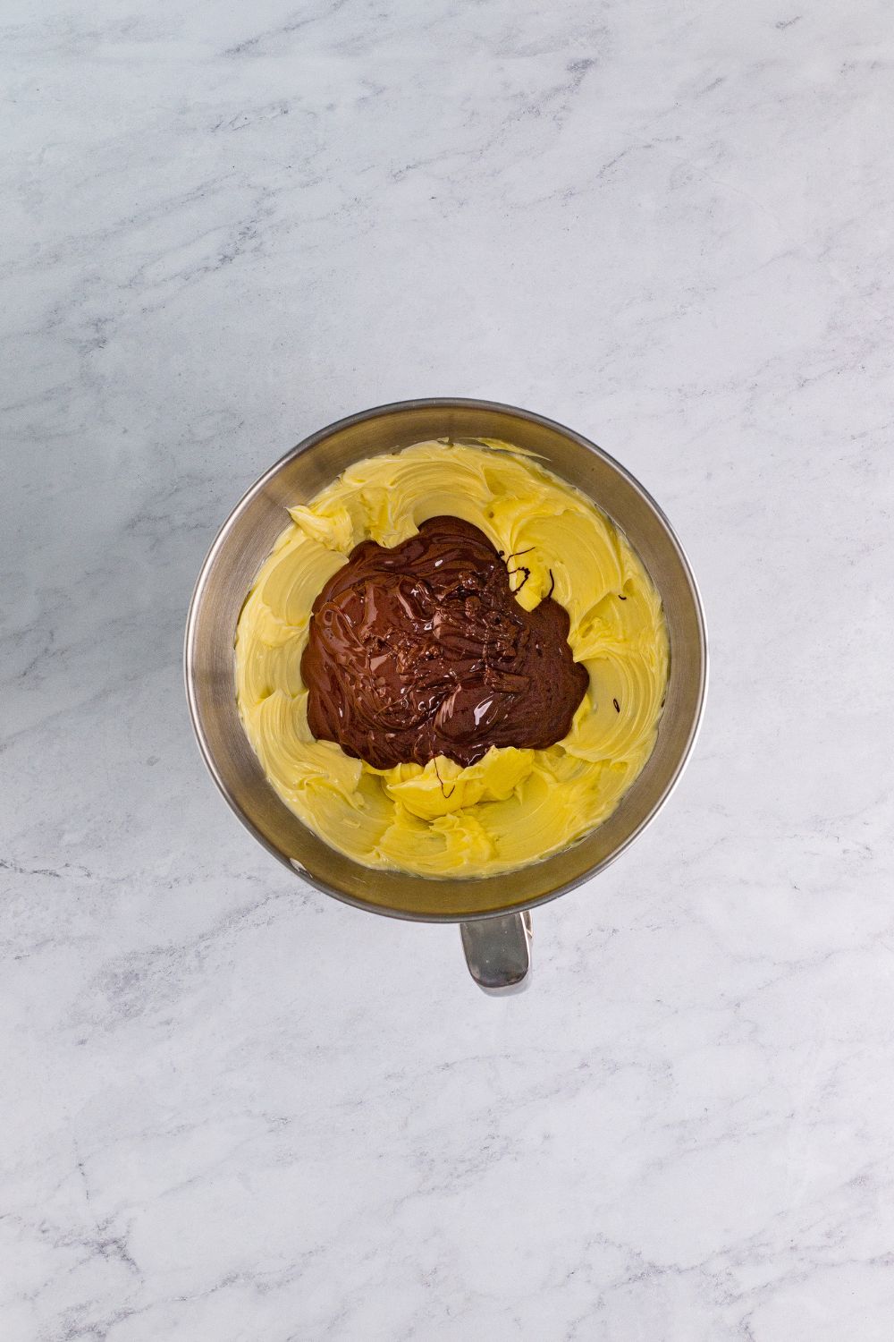 Chocolate Cake Cookies batter in a mixing bowl with chocolate 