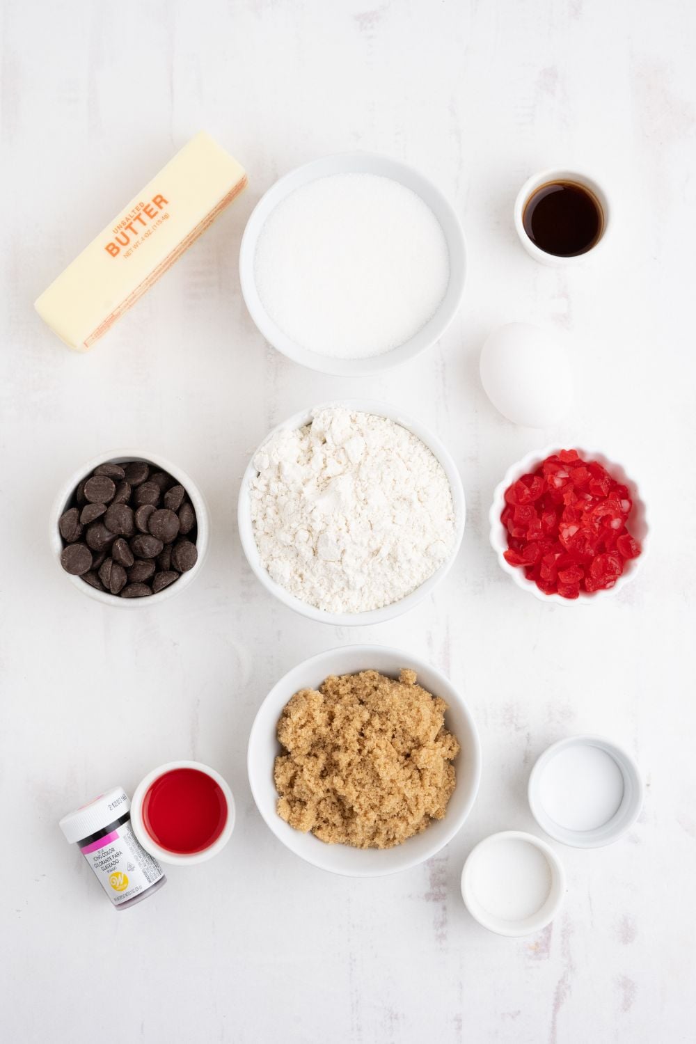 Cherry Chocolate Chip Cookies ingredients on the table in small bowls to show all the ingredients needed for the cookie recipe 