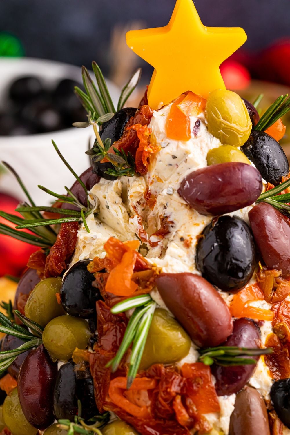 christmas cheese ball on table with some of it removed