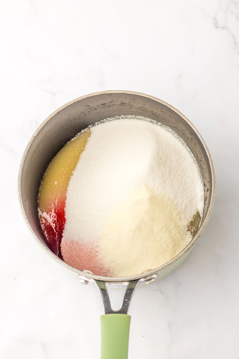 gelatin and sauce in a pan making gummy drops 