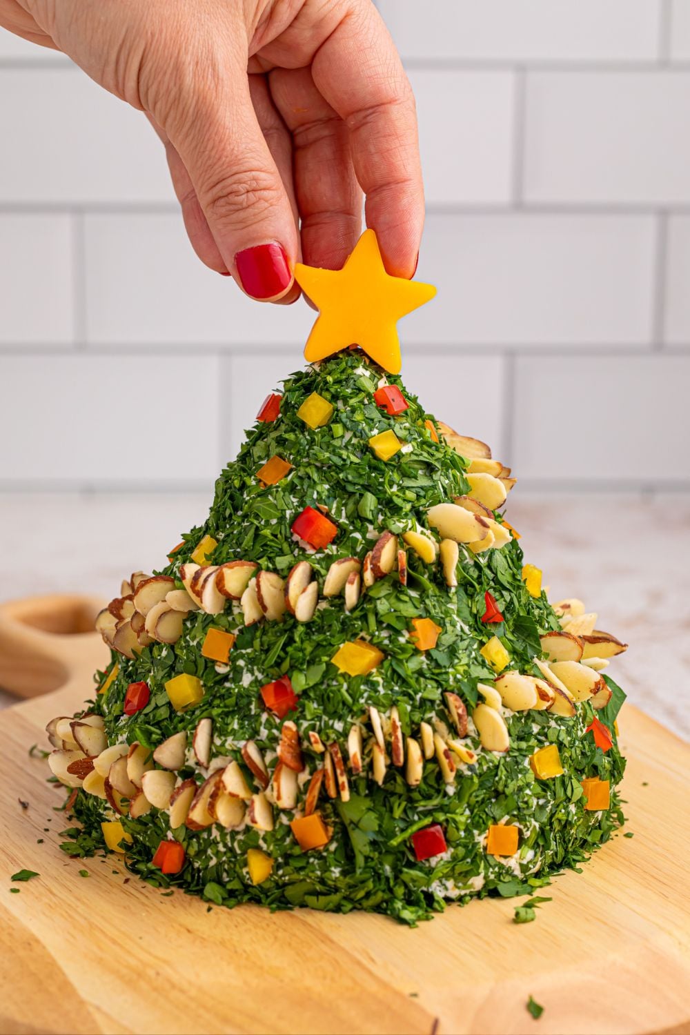 cheese topped cheeseball on wooden table
