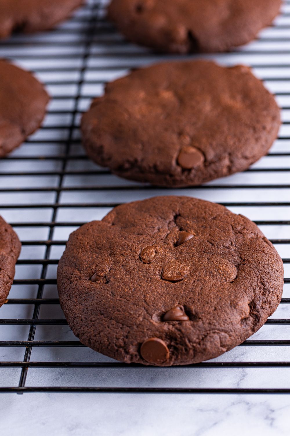 soft baked Chocolate Cake Cookies on a cooling rack