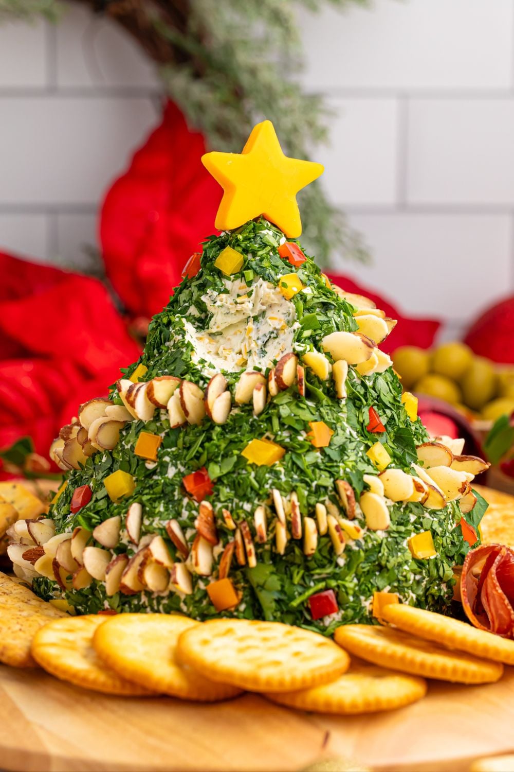 cheeseball in the shape of a tree witha a bit taken out of it