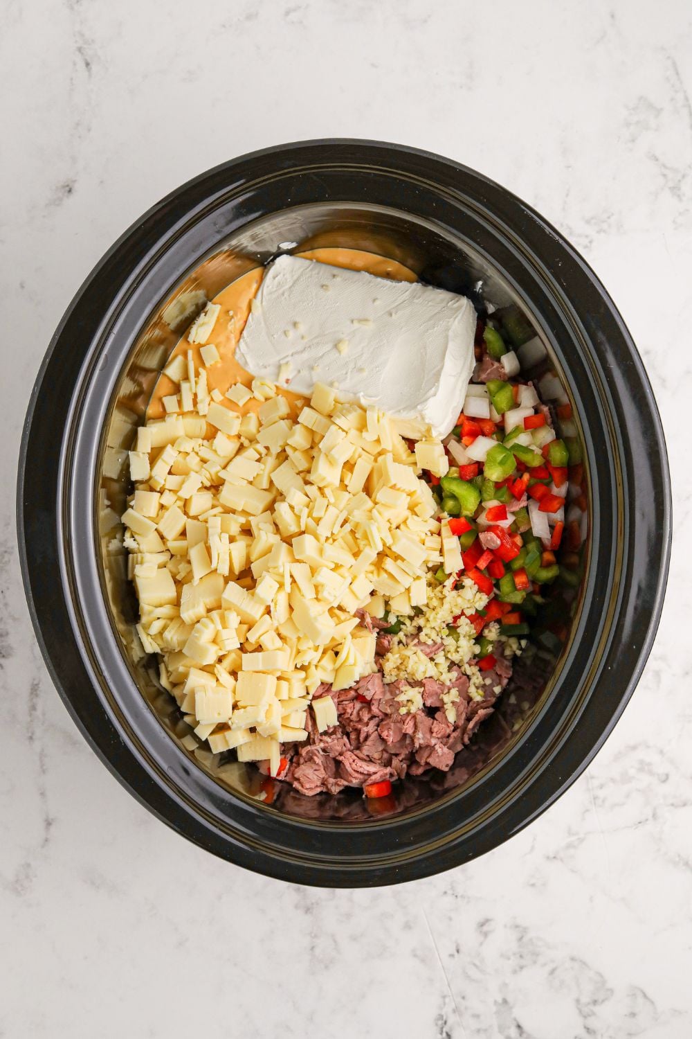 Crock Pot Philly Cheesesteak Dip in an oval crockpot