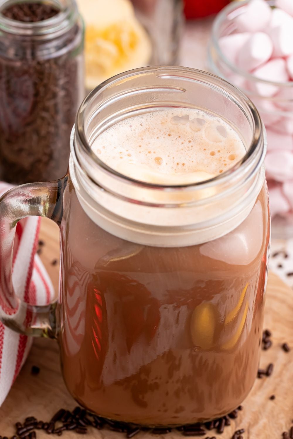 dirty snowman drink in a glass with a side view to show the creamy top