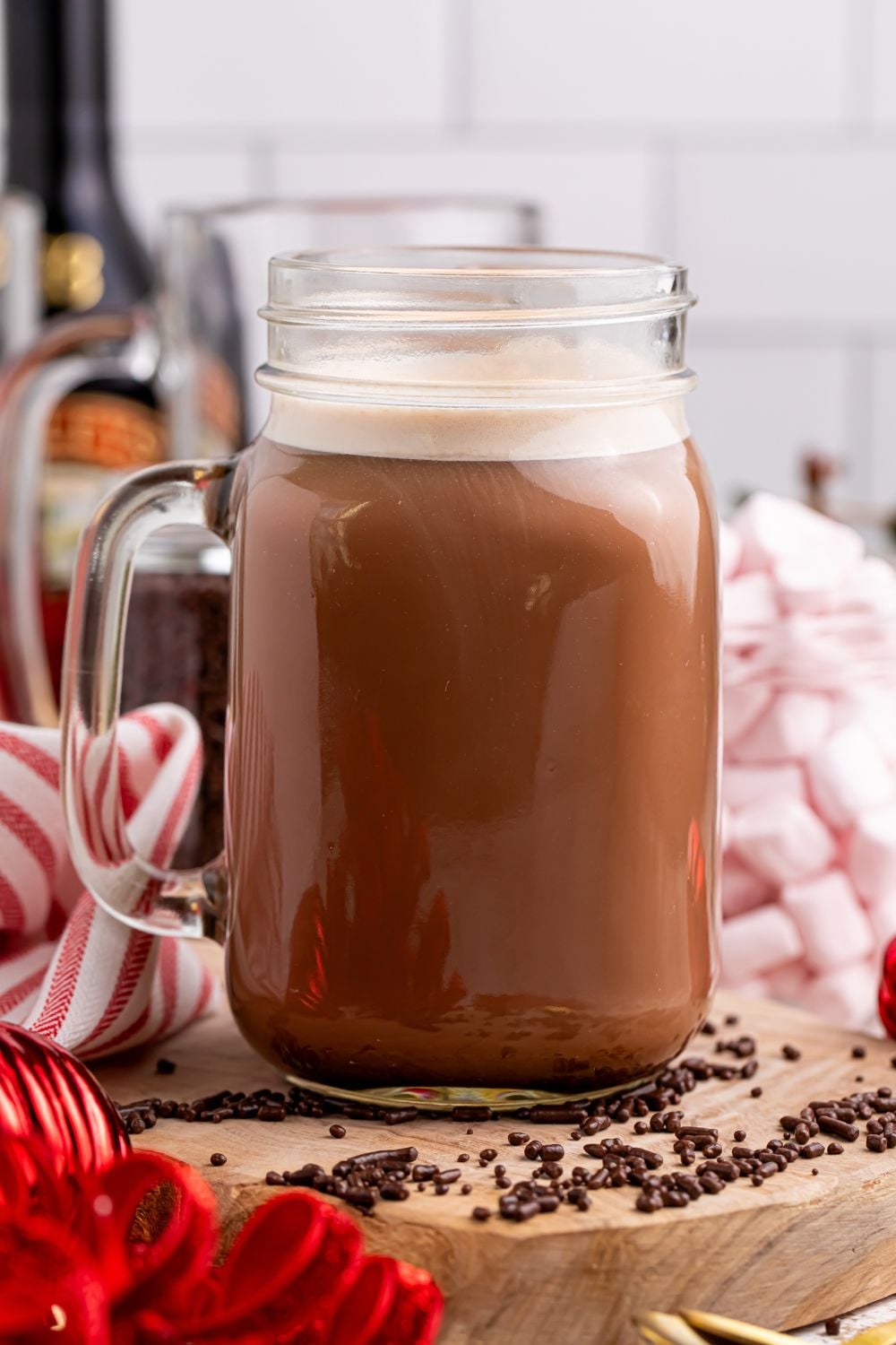hot chocolate drink on table with sprinkles scattered around it on the table