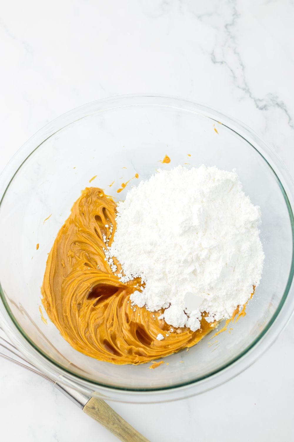 peanut butter and powdered sugar mixed up in a bowl