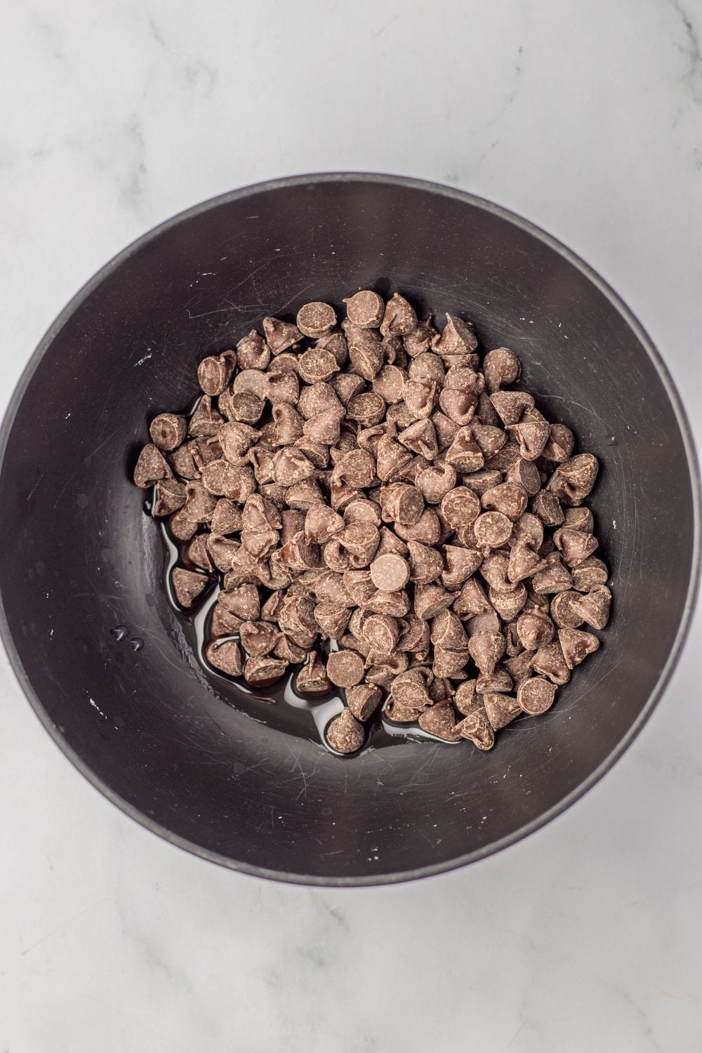 chocolate chips with oil in a bowl