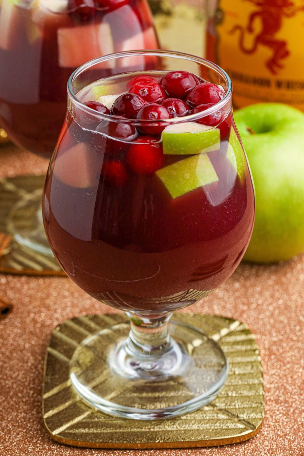 side view of sangria in a wine glass on table