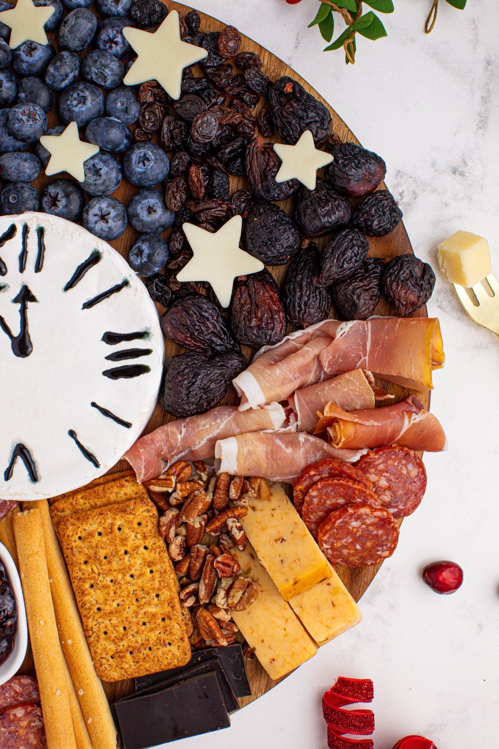 New Year's Eve Charcuterie Board side view showcasing the meats and cheese