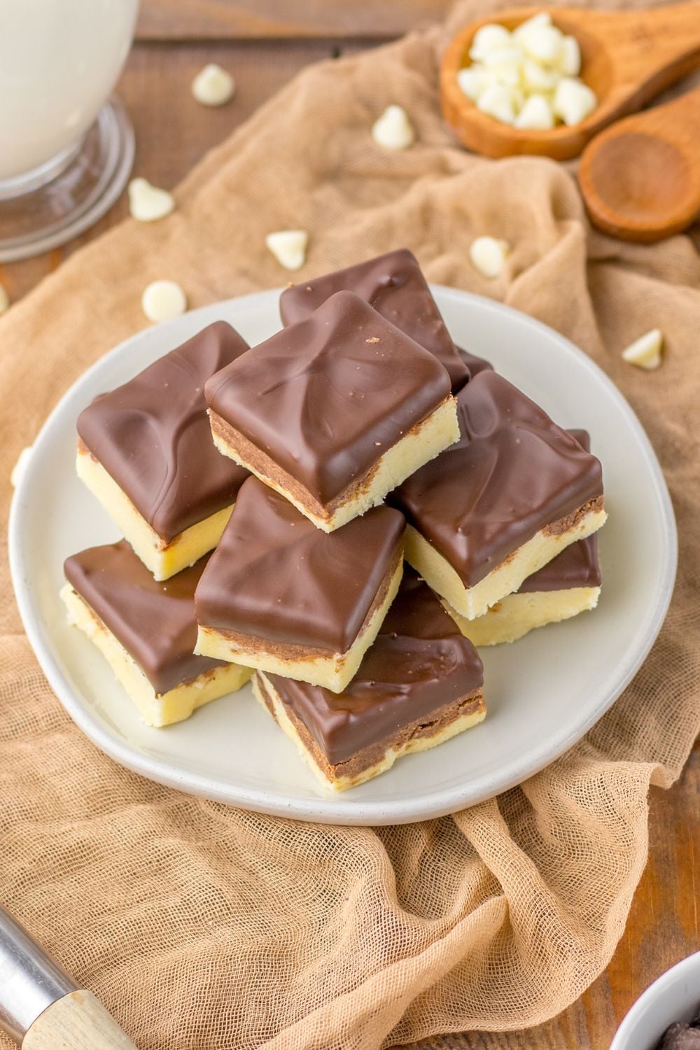 side view of fudge on table with white chocolate chips around it