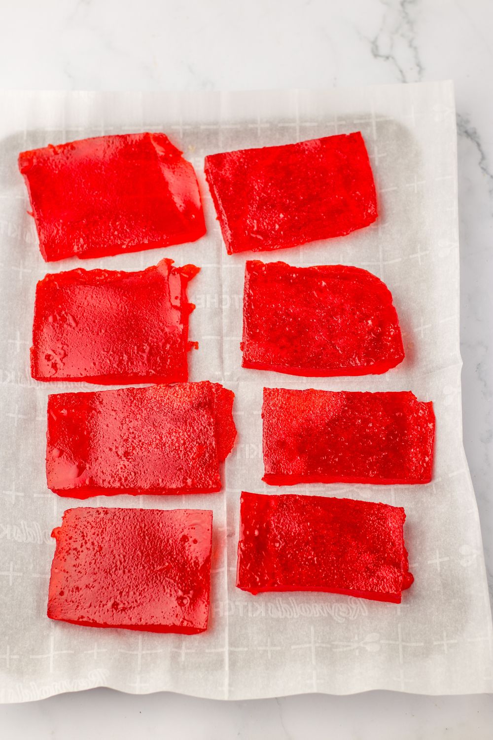 slices of red jello in a pan 