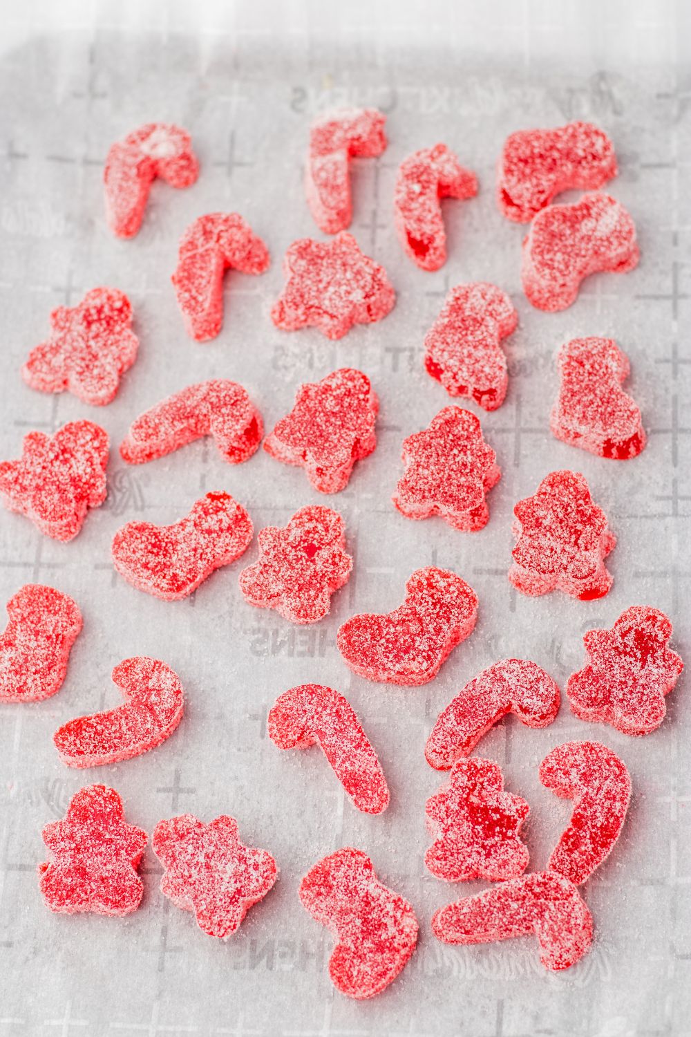 red gumdrops rolled in sugar on table 