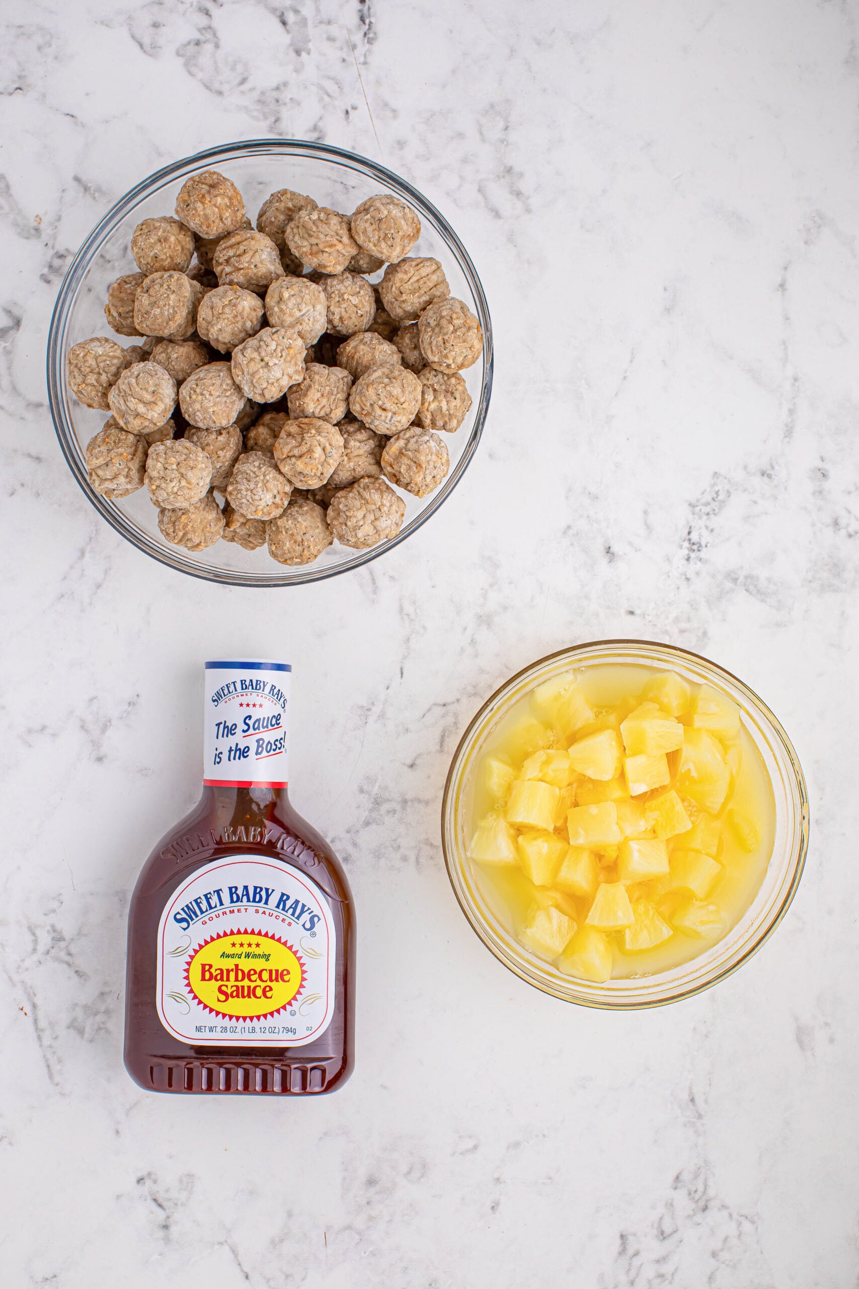 Slow Cooker 3 Ingredient Hawaiian Meatballs on table in glass bowls on table 