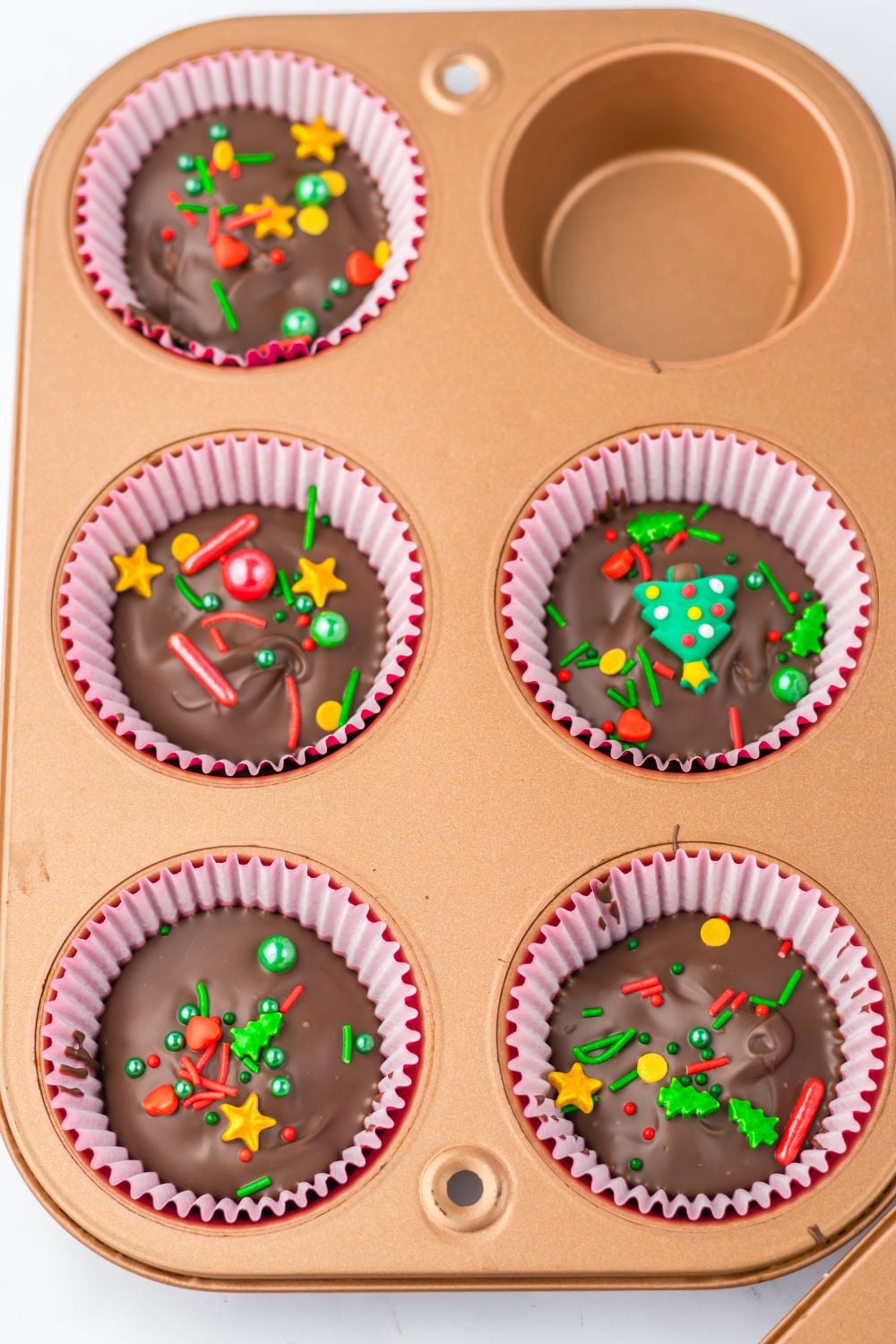 homemade reese cups in a muffin tin