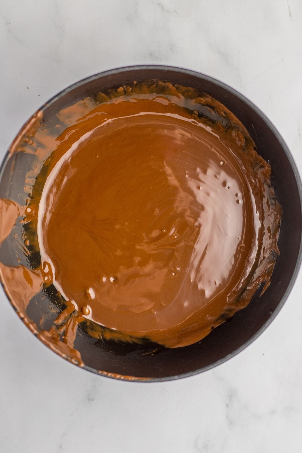 melted chocolate in a bowl on table