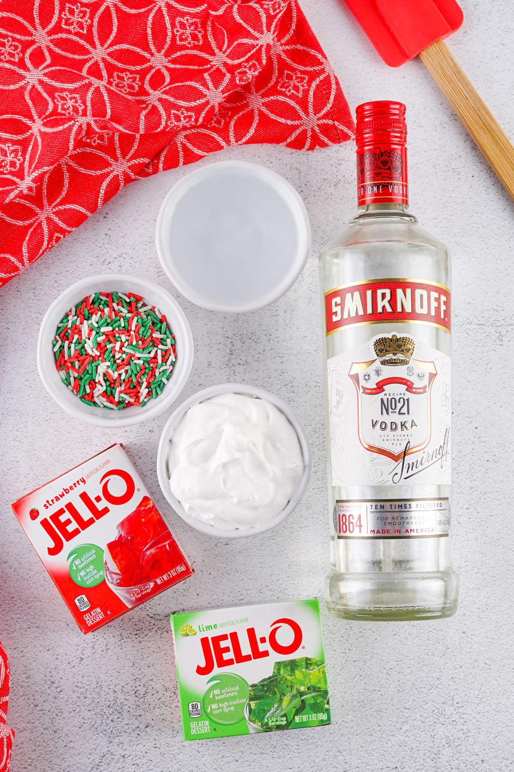 Christmas Jello Shots ingredients in glass bowls on table