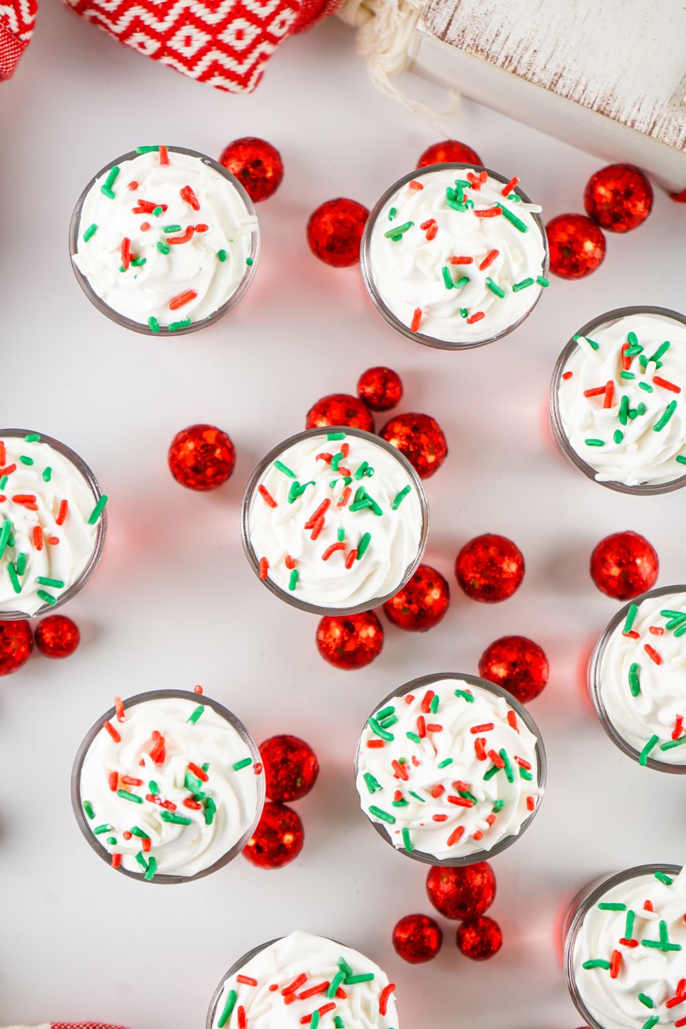 overhead shot of jello shots with sprinkles on table