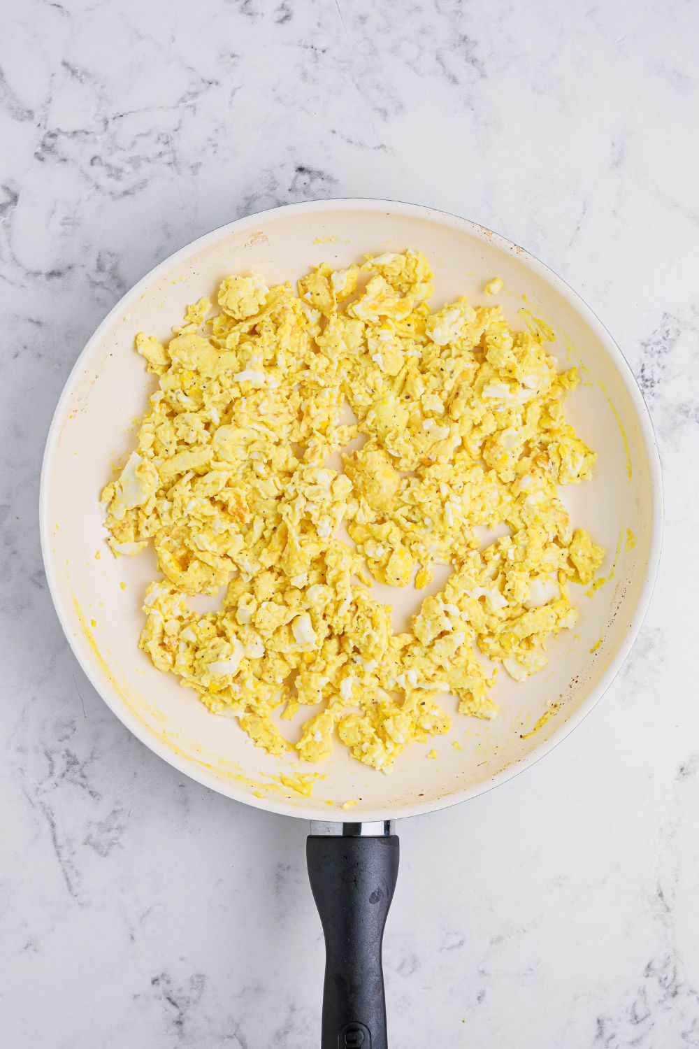 Breakfast Sliders with eggs in a skillet on the table 