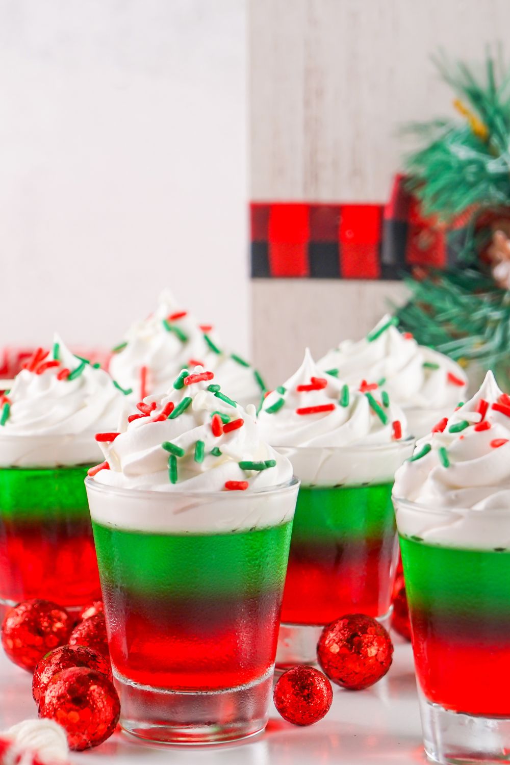 jello shots with Christmas decor around it on table