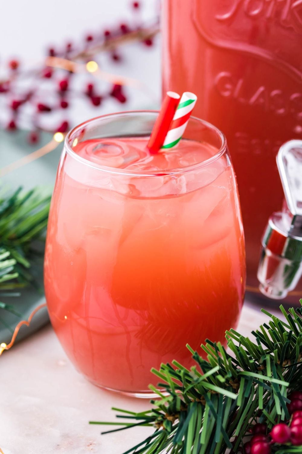 Holiday Punch in glass with straws on table