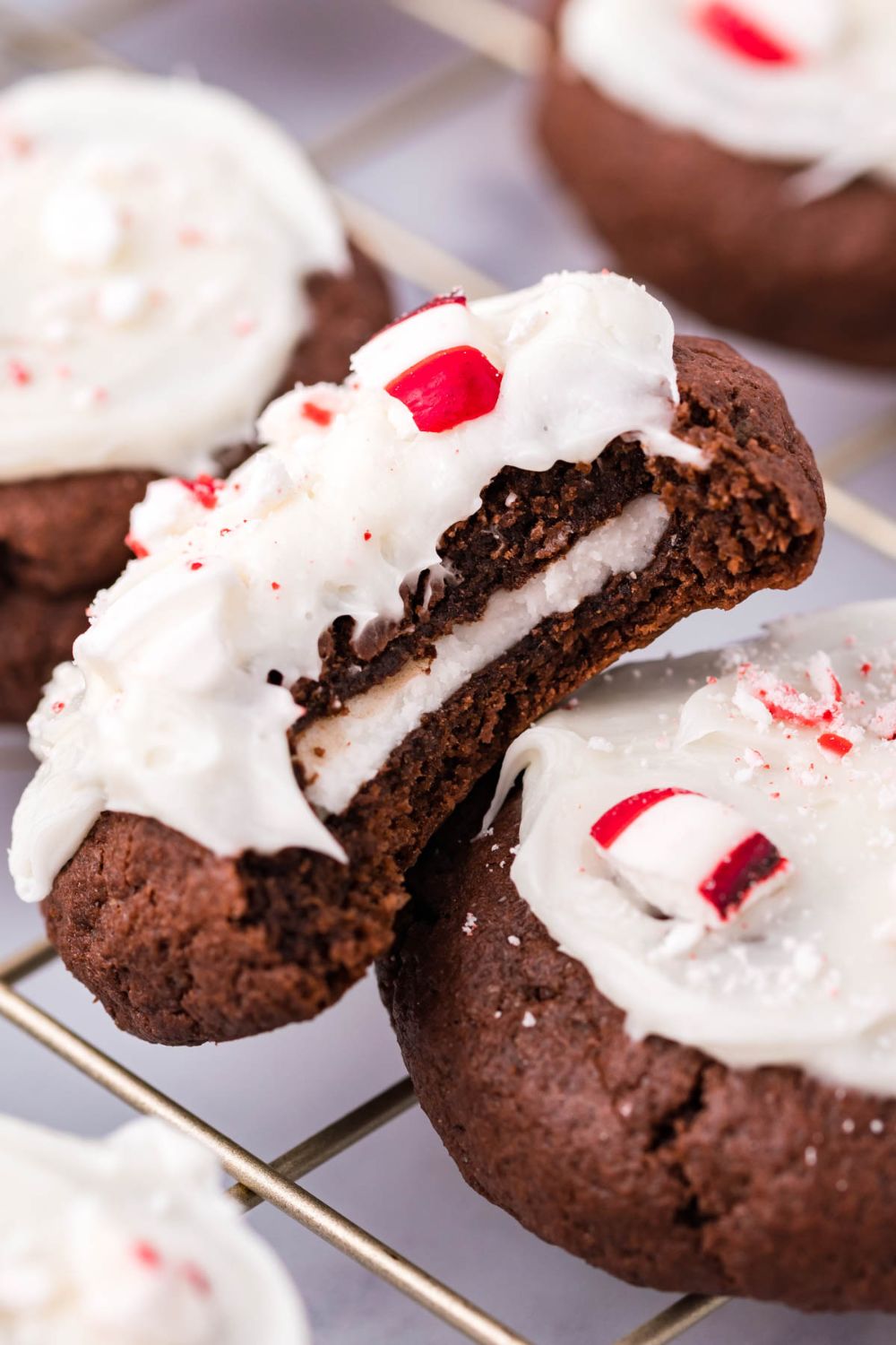 close up of cookies on table with one that has a bite taken out of it 
