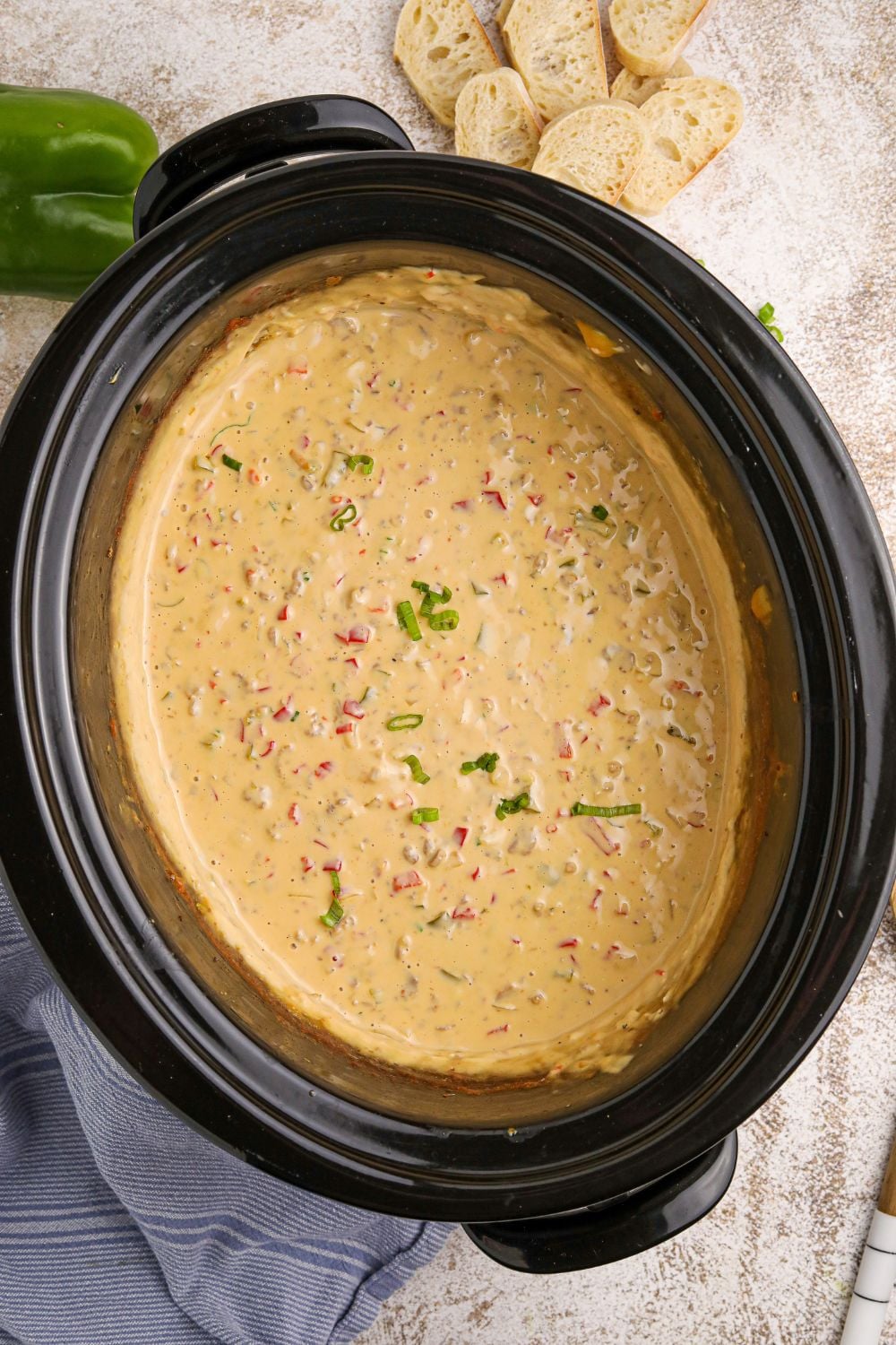 overhead view of Crock Pot Philly Cheesesteak Dip in a slow cooker sitting on counter
