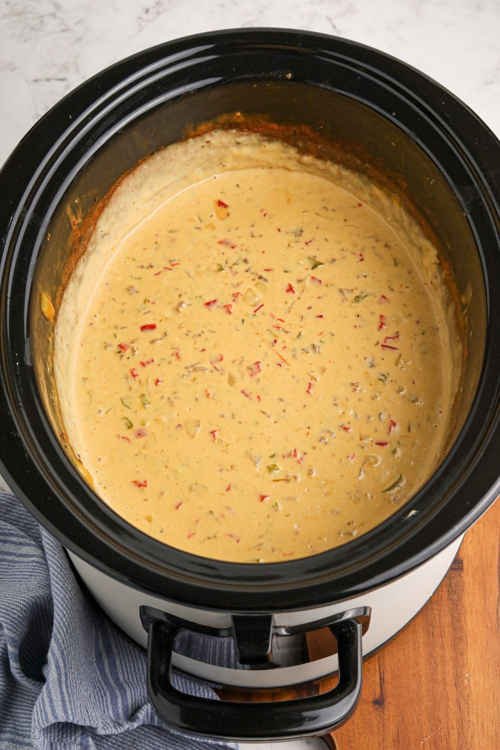 cheese dip melted fully in a slow cooker flavored like Crock Pot Philly Cheesesteak Dip