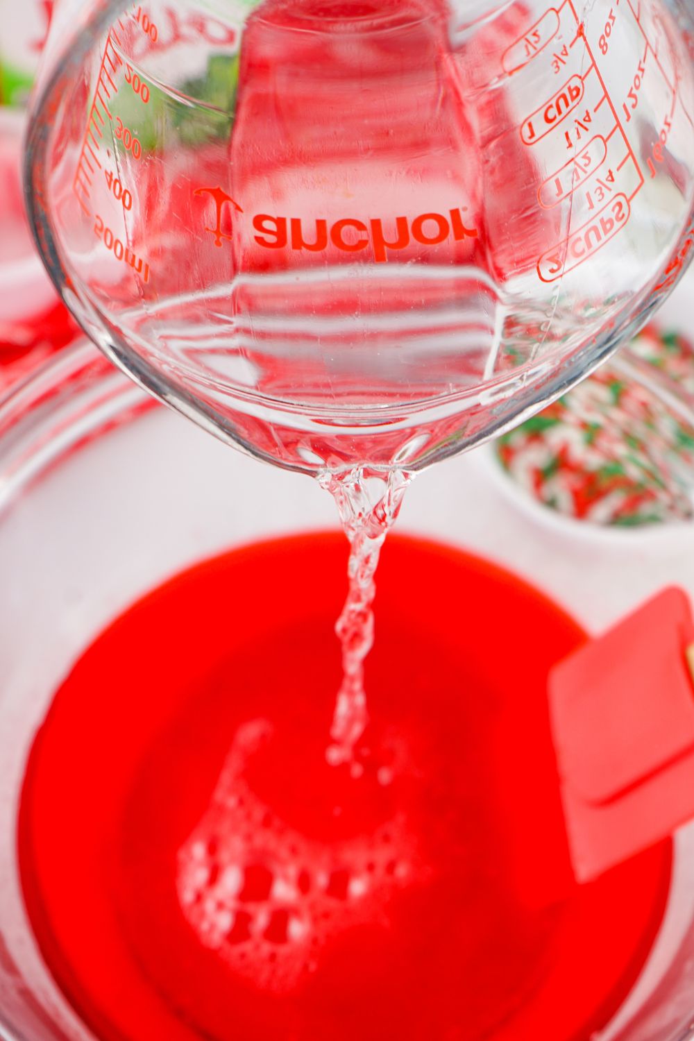 adding vodka in jello bowl