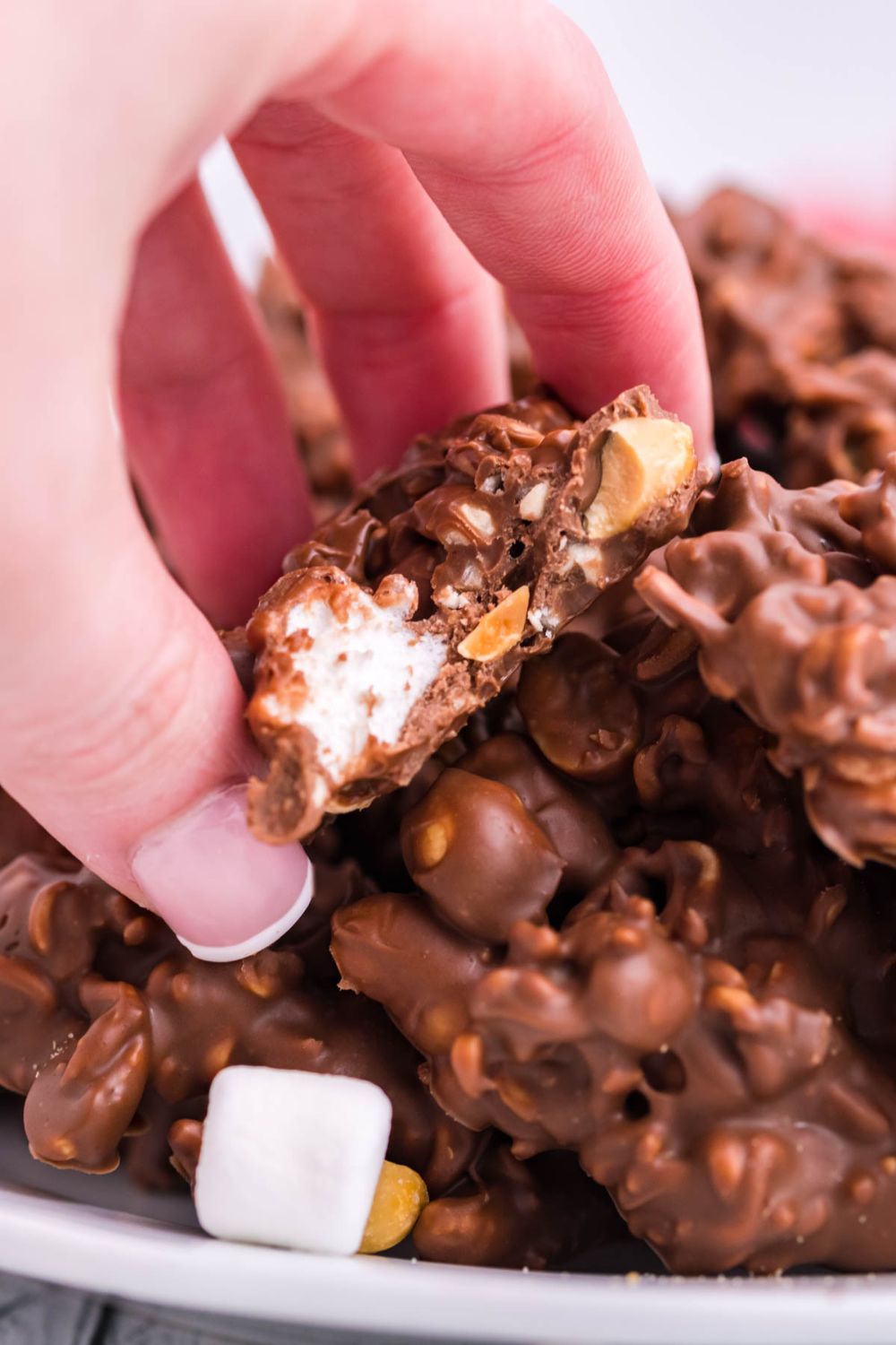 Rocky Road Candy in hand with bite taken out of it