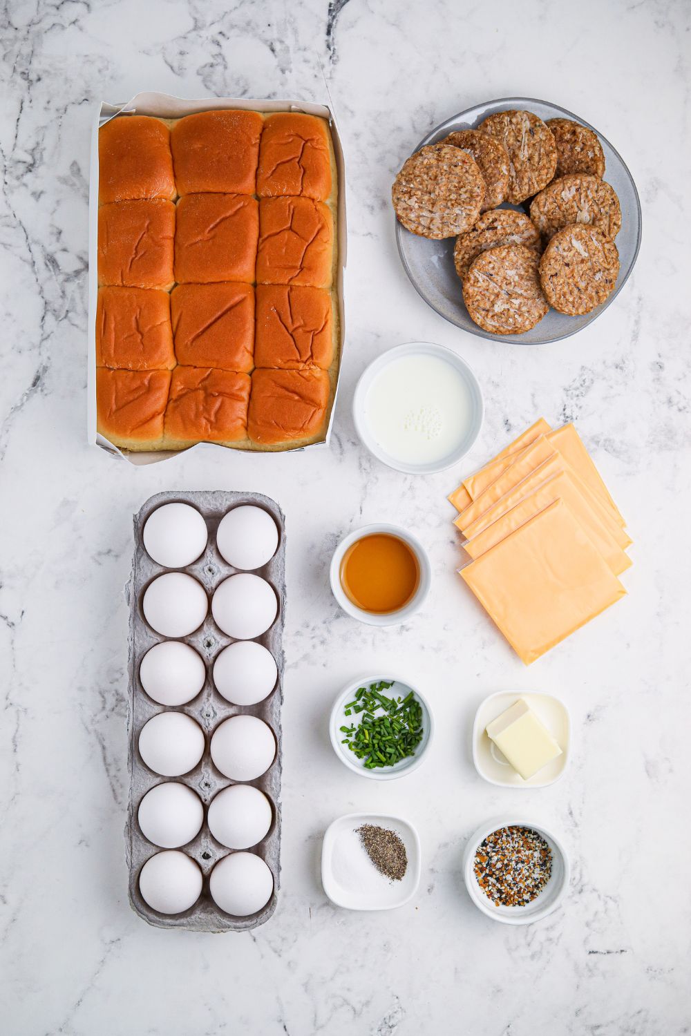 ingredients for Breakfast Sliders on table in small bowls 