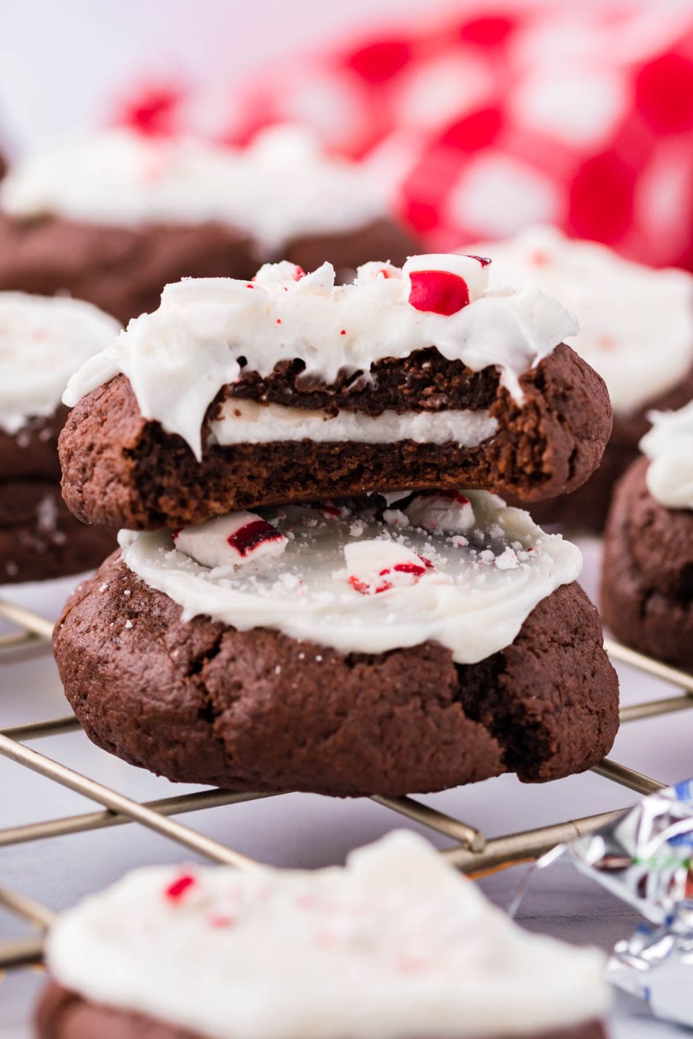 side view of cookies on a table with one that has a bite taken out 