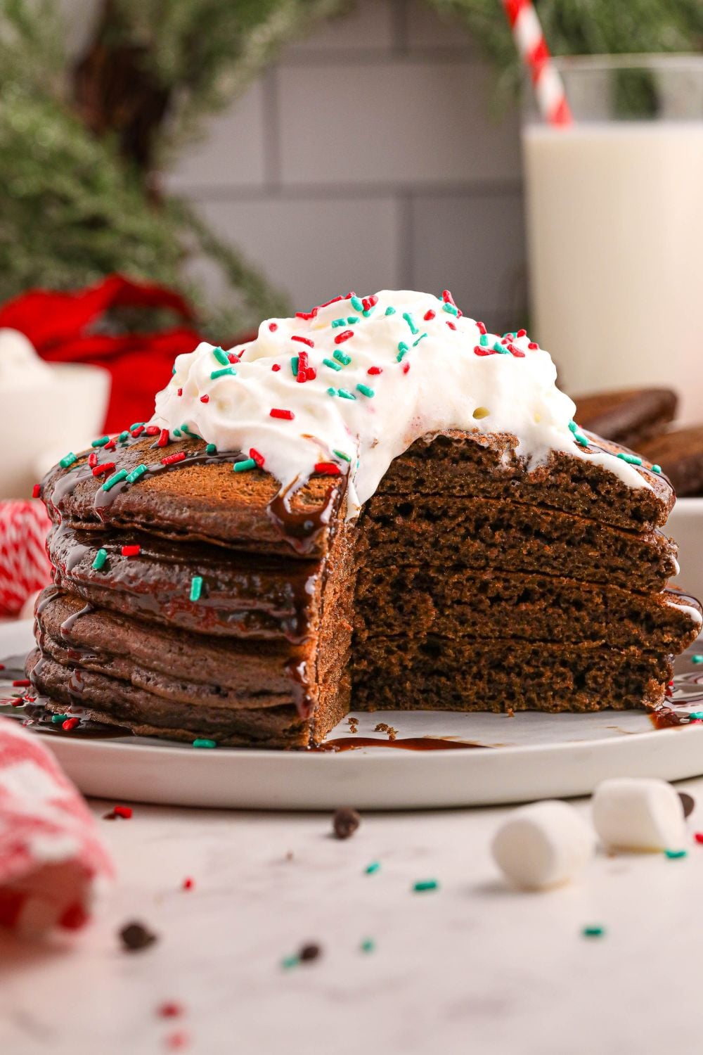 Hot Chocolate Pancakes on plates with a bit of pancakes sliced out of plate