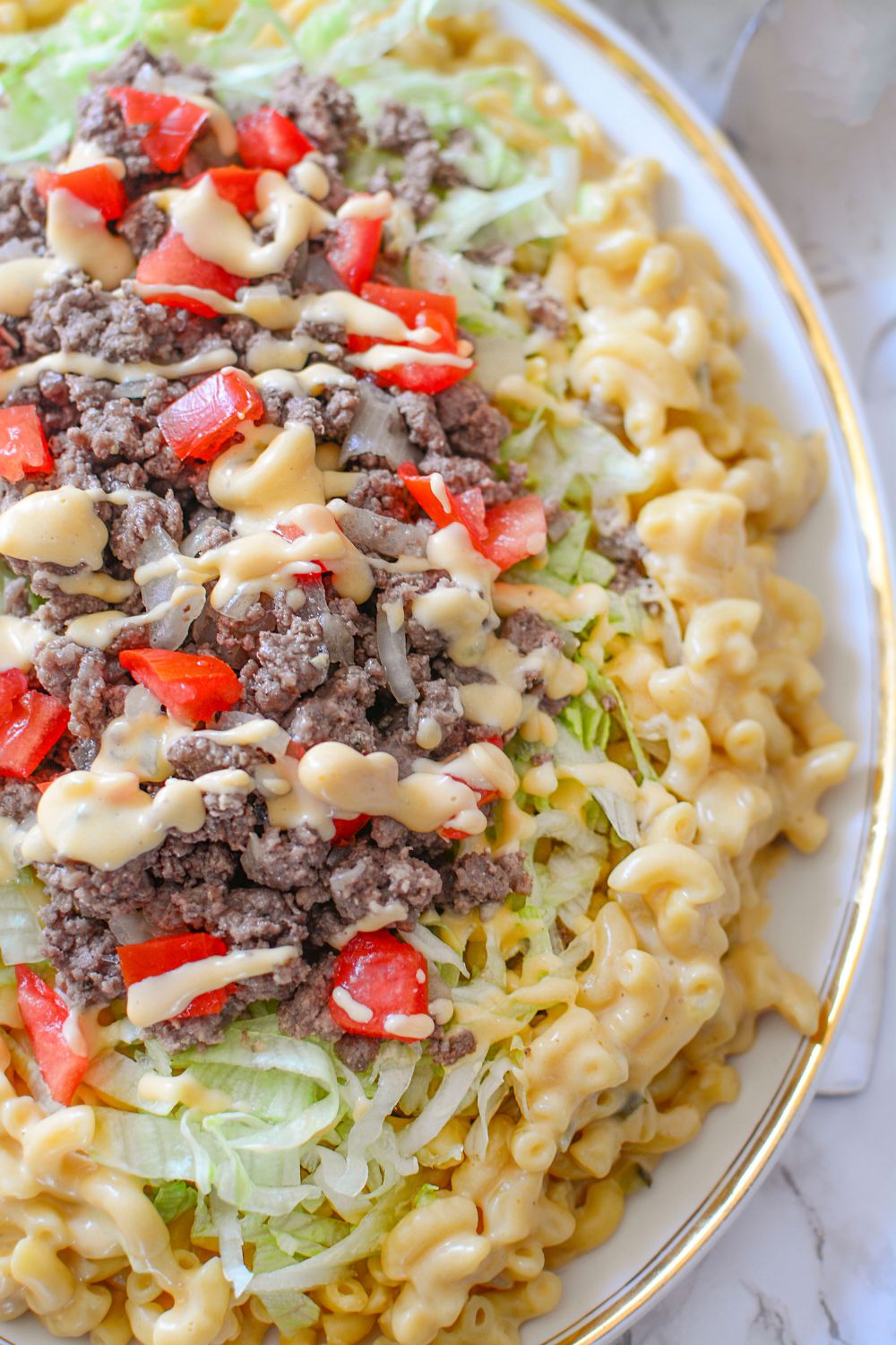 Big Mac Macaroni And Cheese spread out in on a large platter