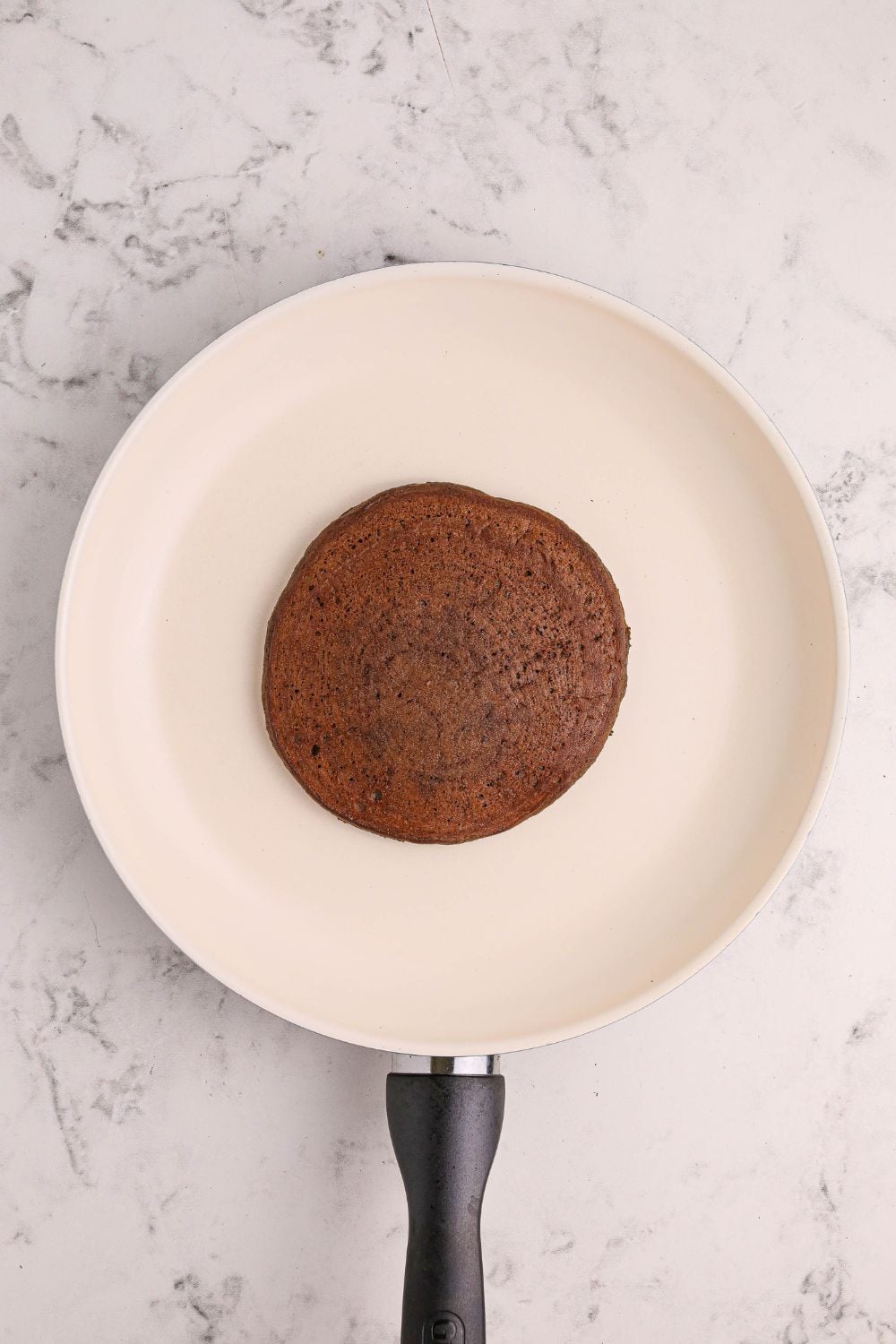 cooking a Hot Chocolate Pancake in a skillet on the stovetop