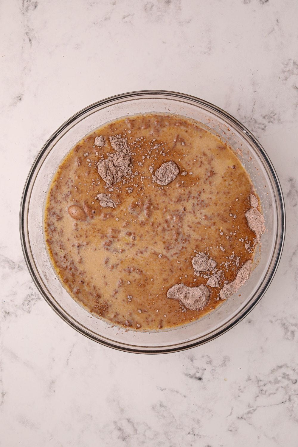 ingredients for Hot Chocolate Pancakes in a mixing bowl on table
