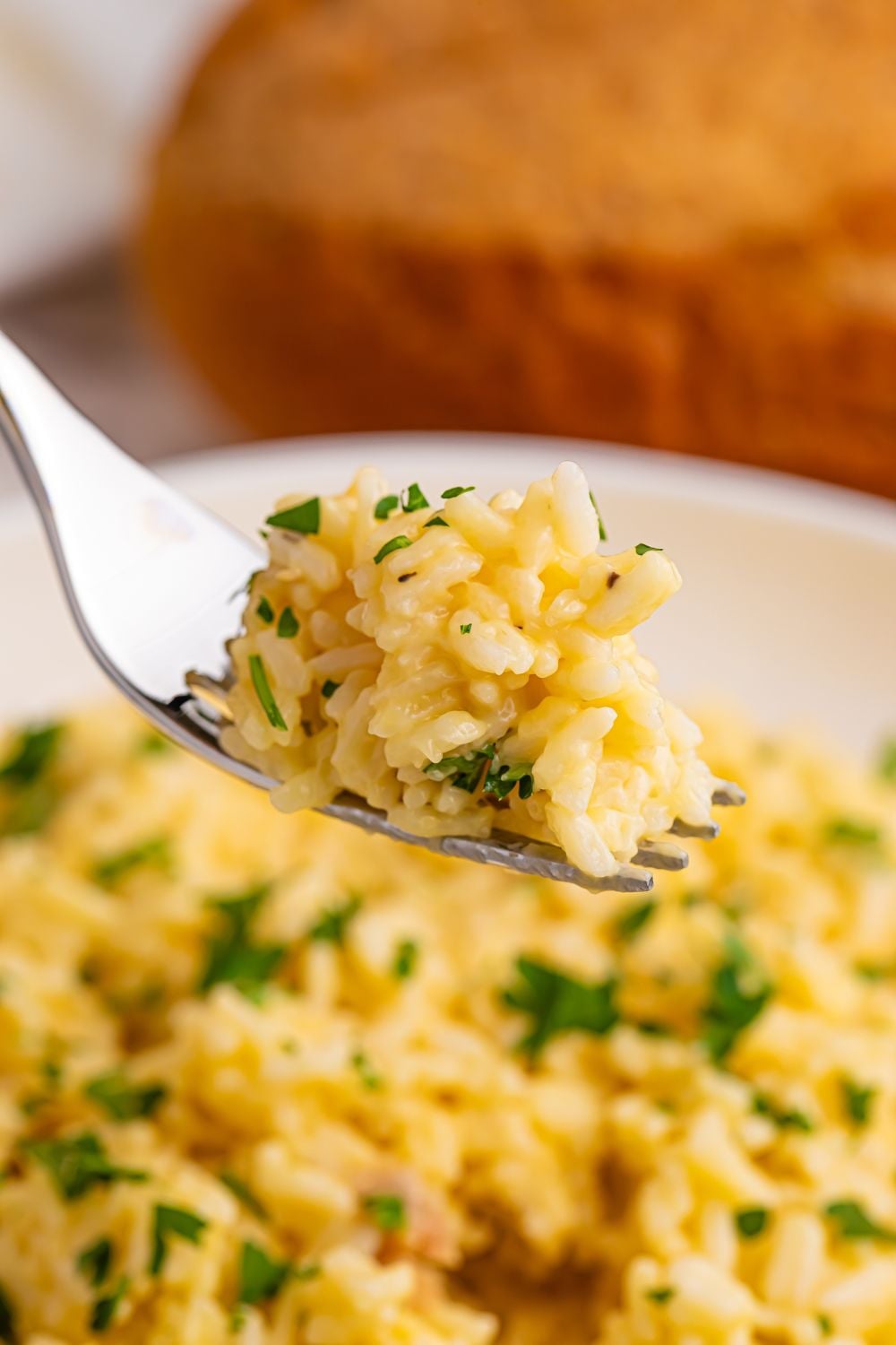 Souper Rice on a fork with some chopped parsley on top