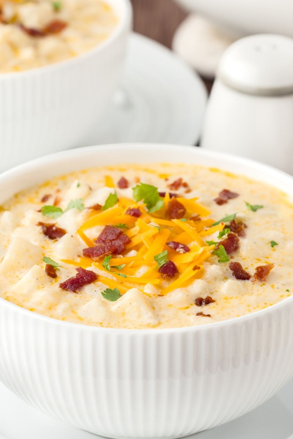 close up look of Hash Brown Potato Soup in a bowl on table