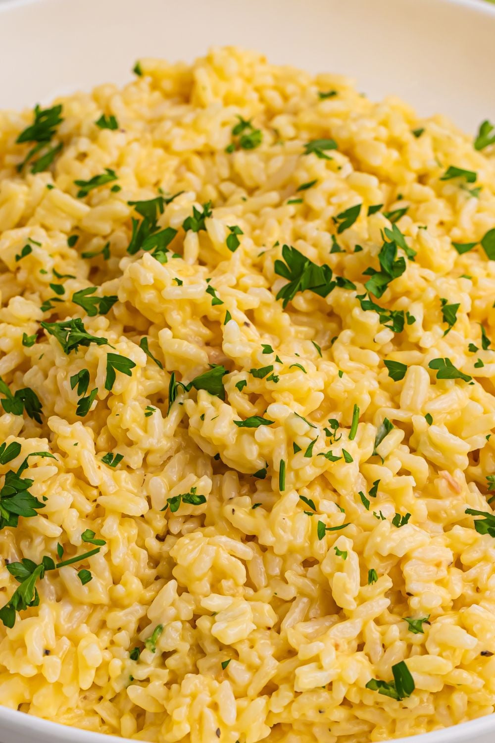 Souper Rice in a bowl with parsley chopped and sprinkled on top of rice