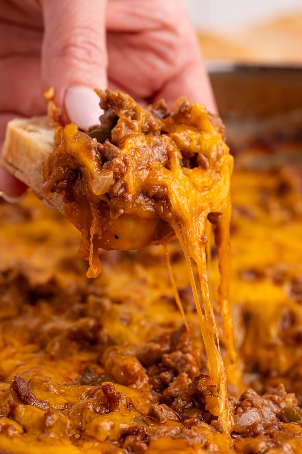 Sloppy Joe Dip being scooped up with some bread