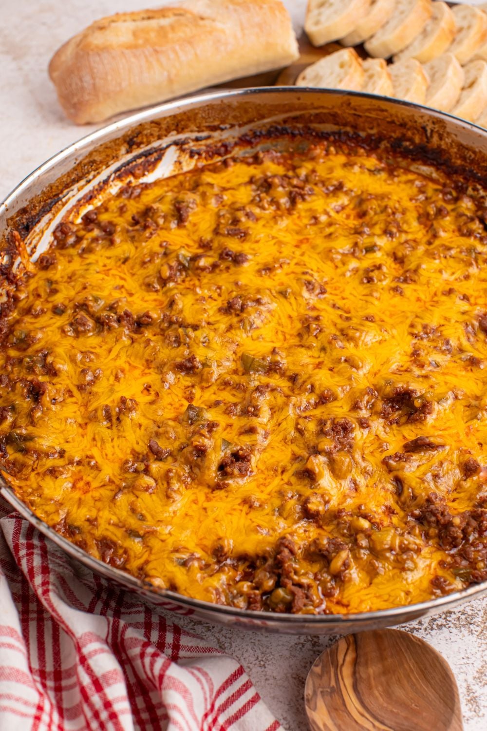 Sloppy Joe Dip with bread sliced in background on table