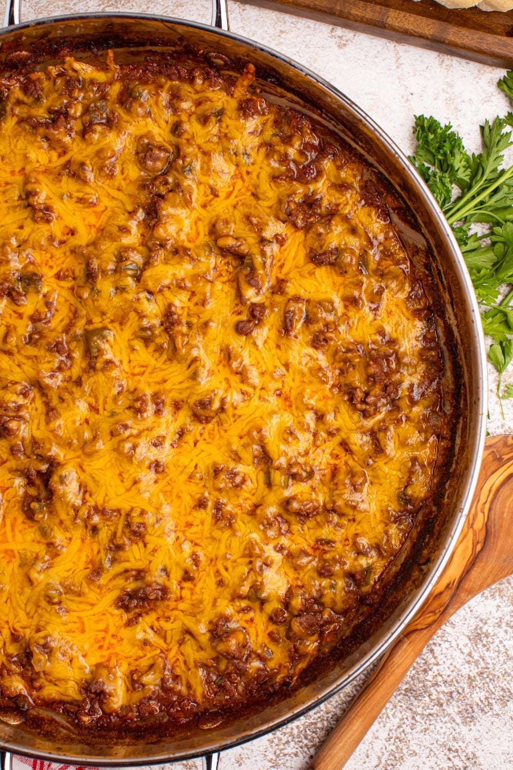 Sloppy Joe Dip in a pan with a spoon on the side of pan