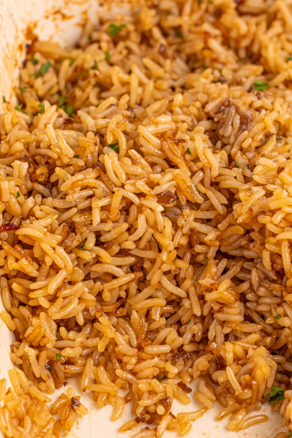 Stick of Butter Rice on a plate with some of the rice gone off plate
