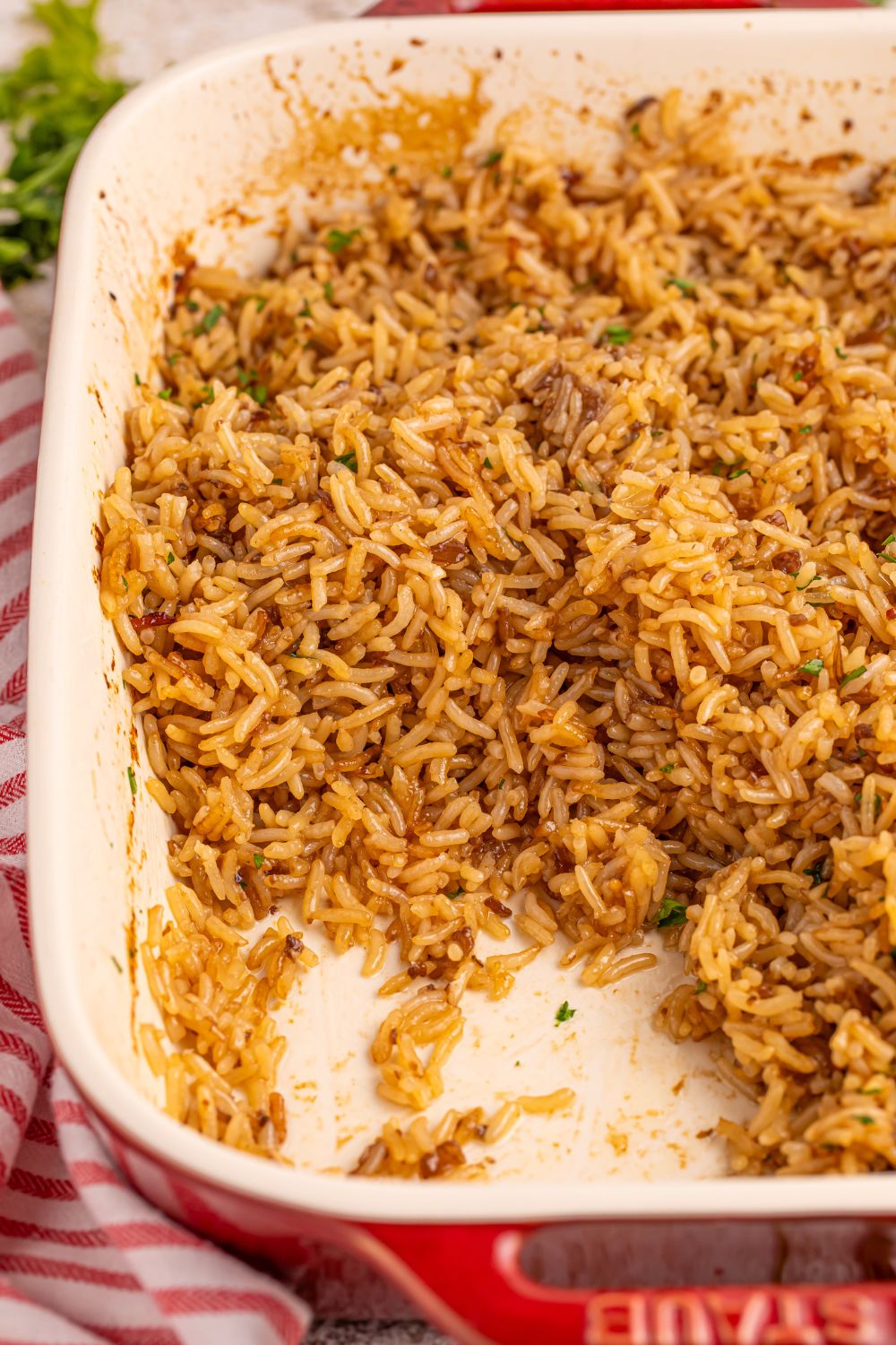Stick of Butter Rice in a pan with a bit taken out of it