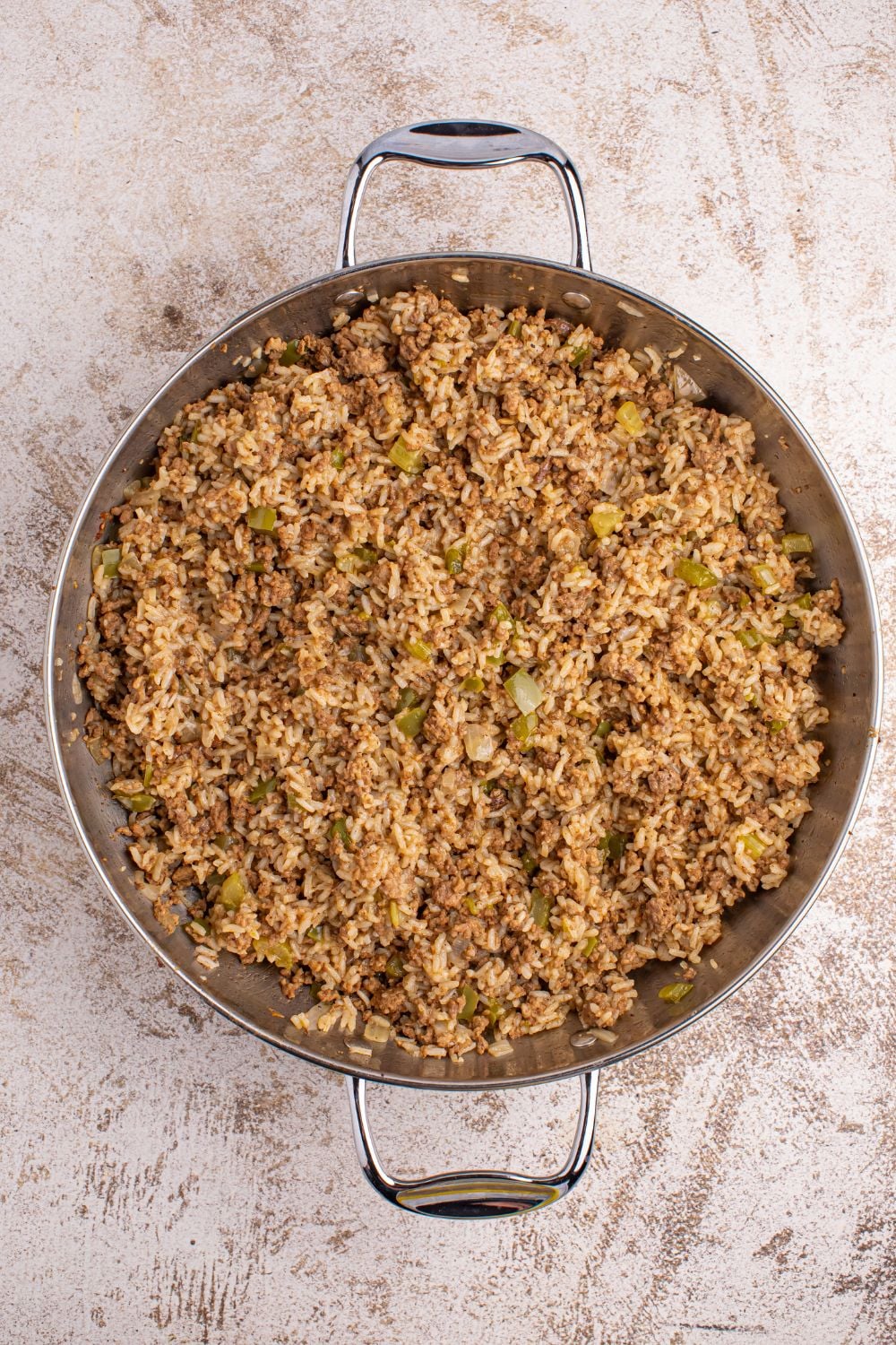Dirty Rice in a pan sitting on table