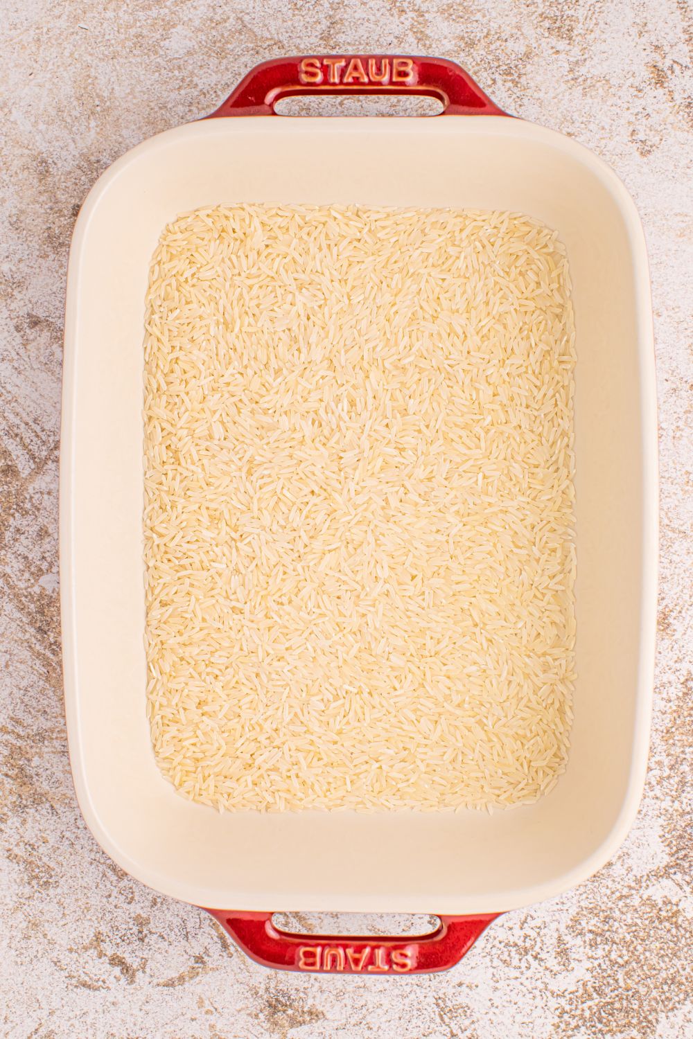 plain rice for Stick of Butter Rice in a casserole dish