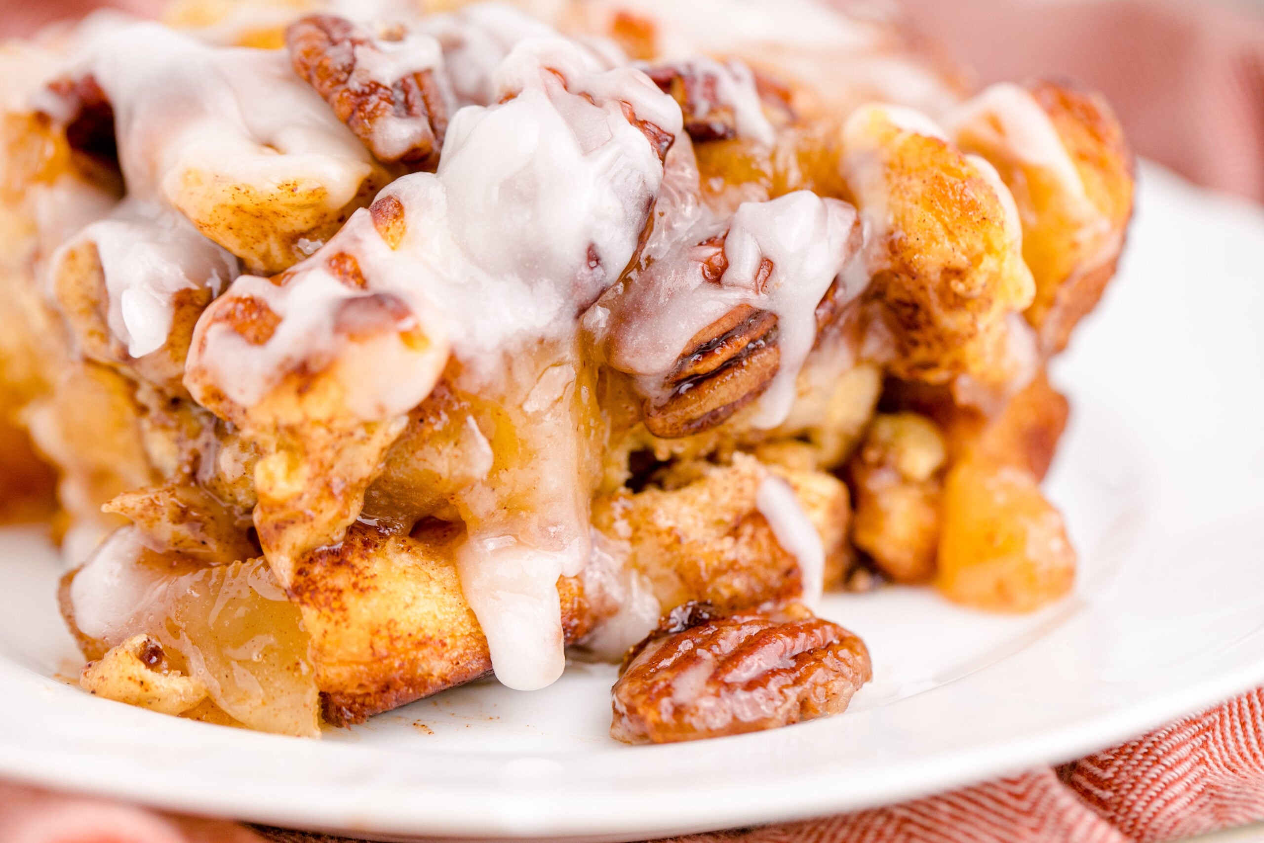 Cinnamon Roll Casserole on a white plate .
